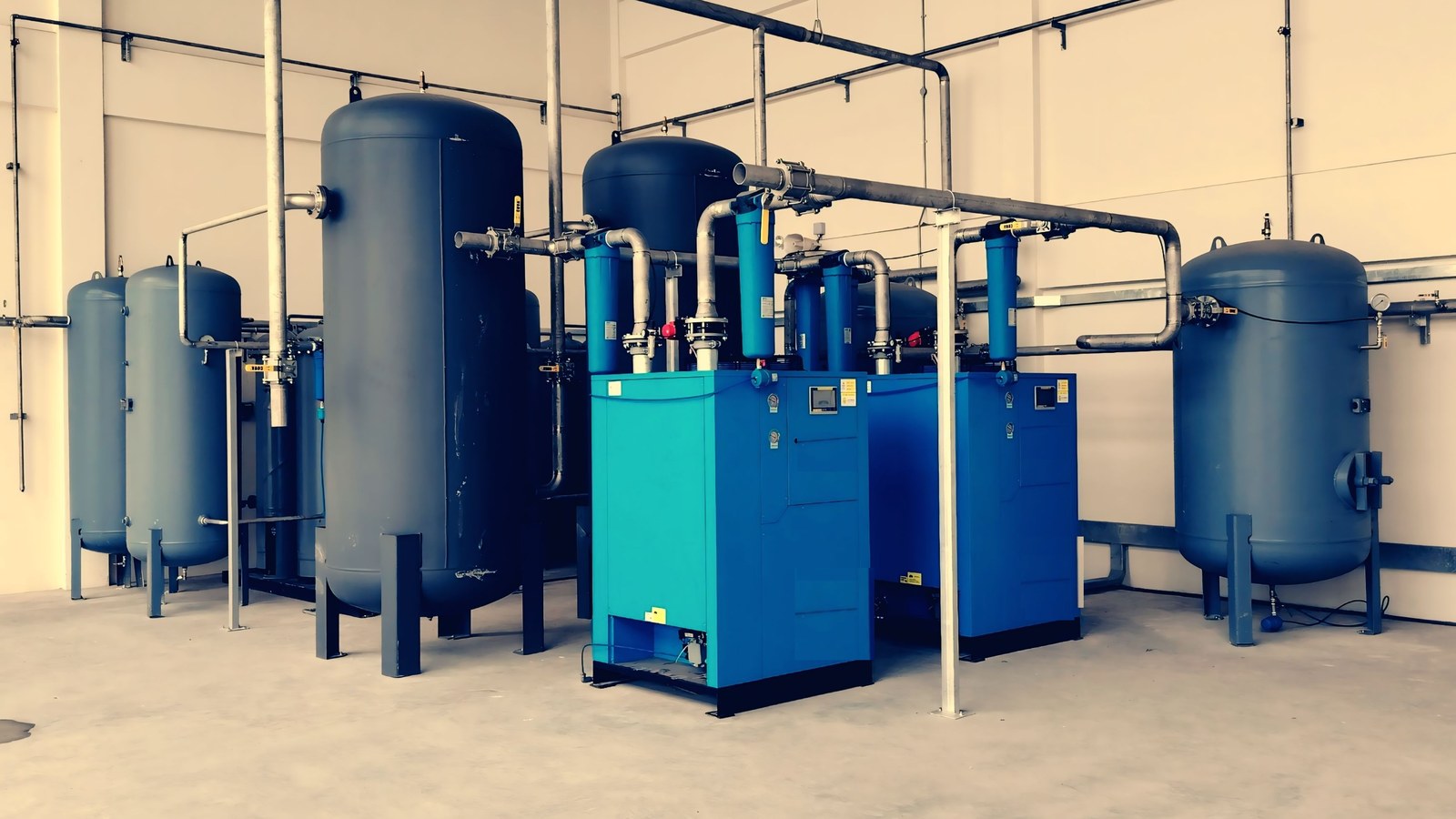 Portable industrial air compressor connected on a factory floor