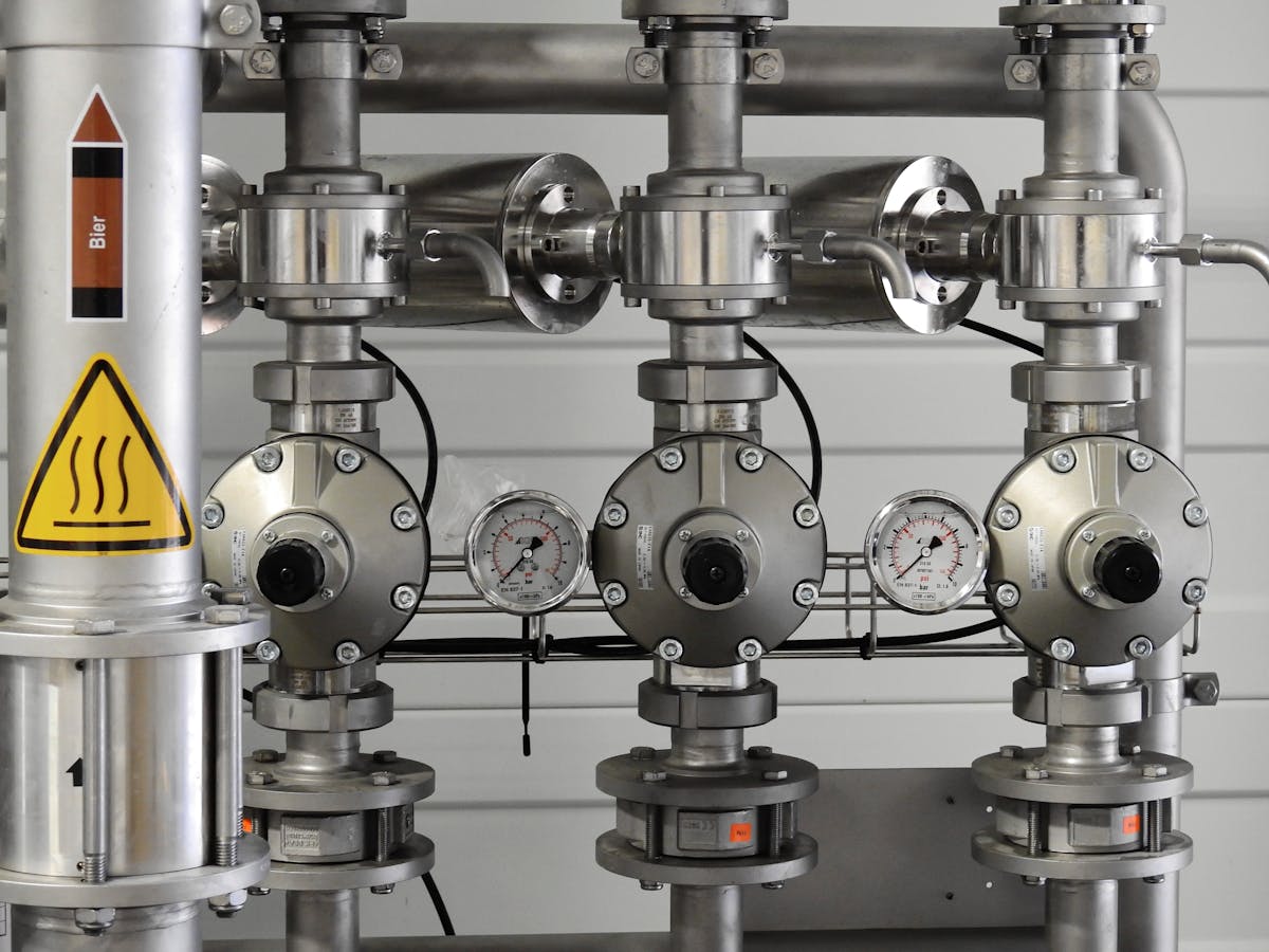 Stainless steel compressed air pipework with pressure gauges and regulators